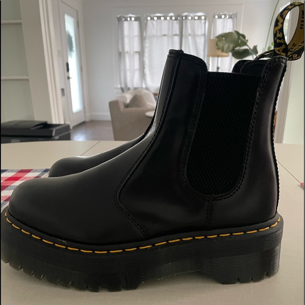 Dr. Martens 2976 Quad Platform Chelsea Boots. Sleek leather upper. Round toe.